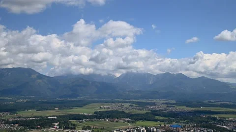 Time lapse white puffy clouds rolling over Alps mountains in Slovenia Stock Footage 138379617