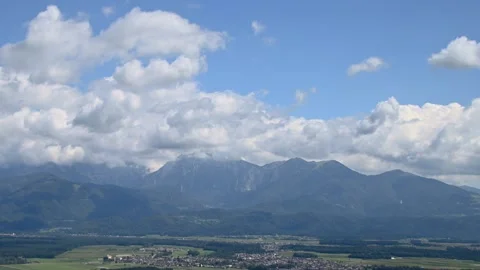 Time lapse white puffy clouds rolling over Alps mountains in Slovenia Stock Footage 138379663
