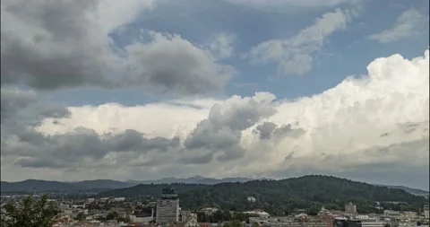 Time lapse of white puffy clouds moving over Ljubljana city, Slovenia Stock Footage 158455563
