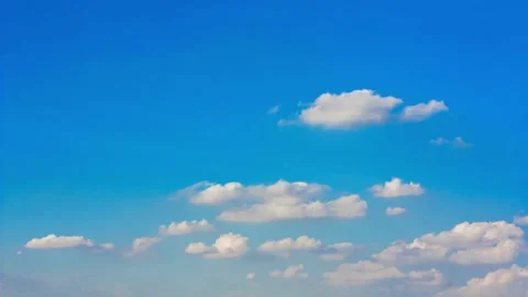 Time lapse white puffy clouds against blue sky time-lapse cumulus background in Stock-Footage 336568490
