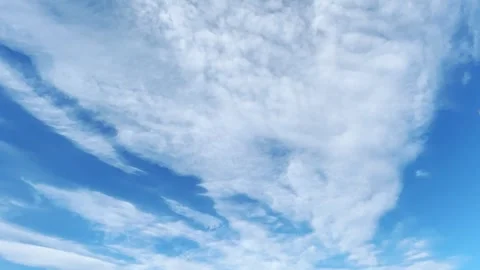 Time Lapse Of White Wispy Clouds Drifting Across A Clear Bright Blue Sky Video stock 342243974