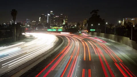 Time lapse wide shot of freeway traffic and the Los Angeles skyline at night 스톡 동영상 83270964
