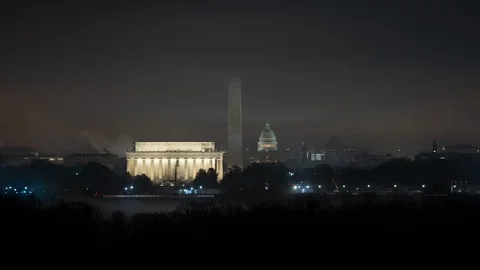 Time lapse wide shot of night fog at the U.S. Capitol and monuments in D.C. Stock Footage 100419888