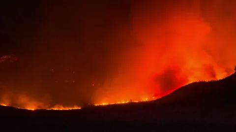Time Lapse - Wildfire in the Forest and Mountains at Night Stock Footage 53554069