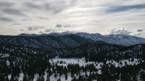 Time Lapse of Wind and Clouds Moving over Snow Covered Mountains in Big Bear Stock Footage 150774958