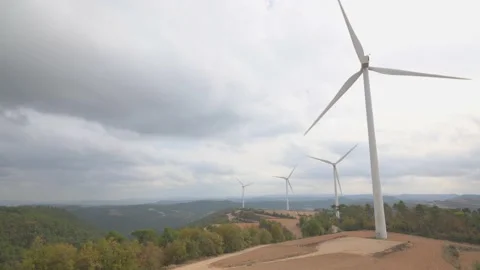 Time lapse of a wind farm under cloudy skies. Environment concept. Stock Footage 220418760