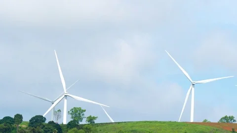Time lapse of wind mill turbine rotation on the cloudy sky Stock Footage 82207351