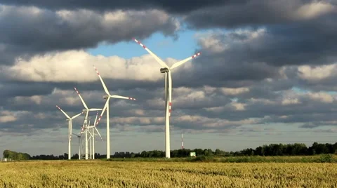 Time lapse wind power station turbines in sunny weather with clouds on wind Stock Footage 65137401