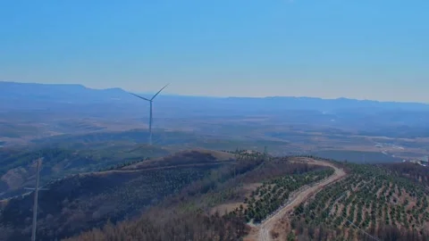Time lapse of wind turbines on mountain hills at dusk Stock Footage 333227882