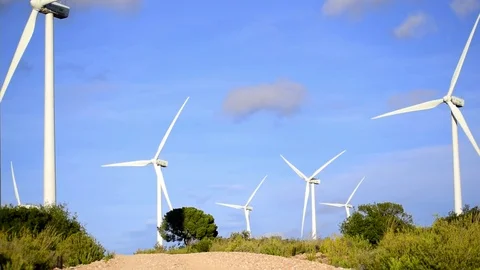 Time lapse of windmills rotating in Spanish wind farm against cloudy sky. Stock Footage 119183580