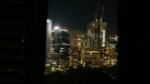 Time lapse window view cranes on a new build surrounded by skyscrapers 4K Video stock 309068917