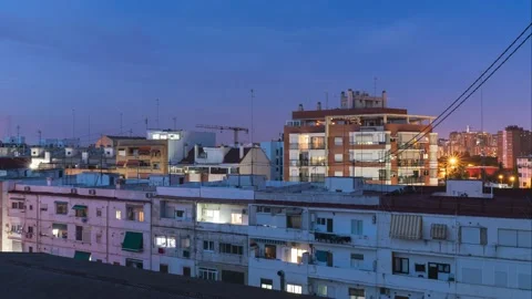 Time lapse of windows light apartment building from blue hour to night Stock Footage 133227229