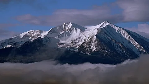 Time-lapse:  Winter Mountain In Sea of Moving Clouds Stock Footage 334133680