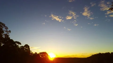 Time Lapse Winter Sunset with Floating Clouds  Stock Footage 65453121