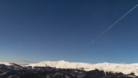 Time-lapse with Winter time nightscape in the snowy mountains Stock Footage 101519056