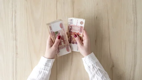 Time lapse. Woman counts five thousand rubles Stock Footage 133807451
