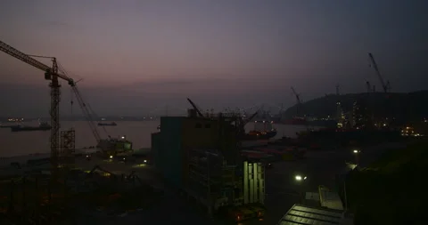 Time-lapse. Work during sunset at the Okpo shipyard. Video stock 166106245