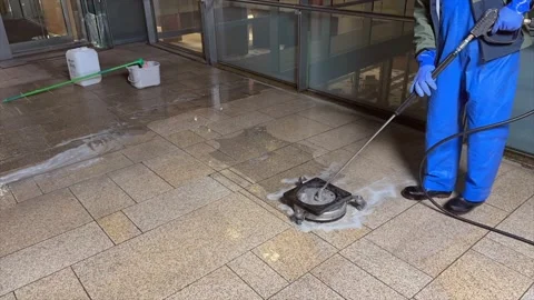 Time Lapse. A worker cleans a dirty beige granite floor with a high pressur.. Stock Footage 236801819