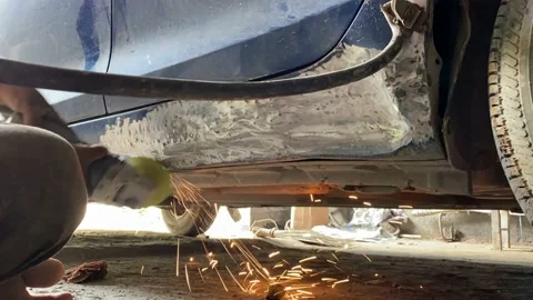 Time lapse, worker fixing damaged car with angle grinder to fix metal body. Stock Footage 167738438