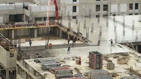 Time lapse of workers at construction site pour and level concrete. Stock Footage 138635147