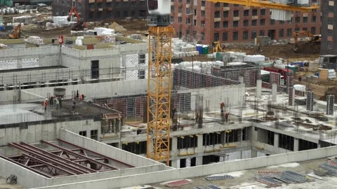 Time lapse of workers pour concrete, on background of construction site Stock Footage