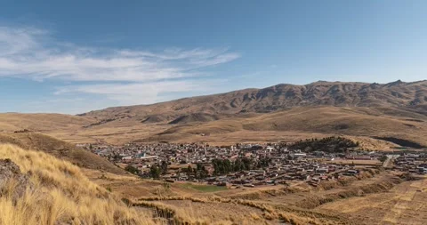 Time lapse of yellow grass and distant town Stock Footage 293093501