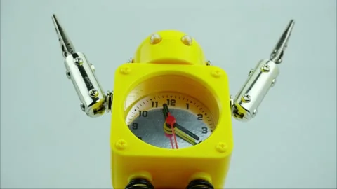 Time lapse, The yellow robot clock is showing the running of time. Stock Footage 167618871