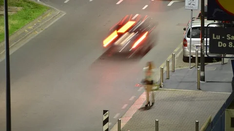 Time lapse of young blonde hooker prostitute on sidewalk of an urban street Stock Footage 90234398