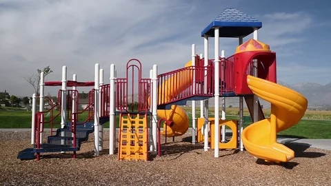 Time lapse of young boy running around an empty playground Stock Footage 94930195