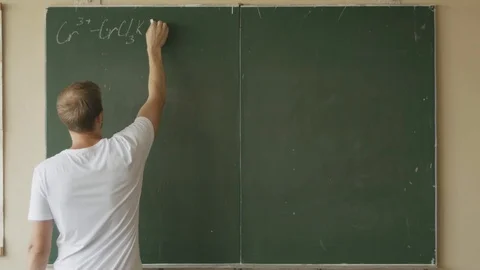 A time lapse of a young chemist student writes a complicated chemistry equation  스톡 동영상 113348306