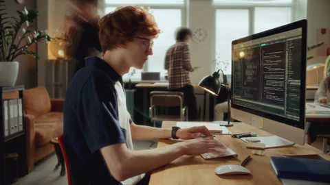 Time Lapse of Young Developer Typing Code on Computer at Modern Office Desk Stock Footage 305319360