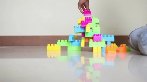 Time Lapse of Young Girl Playing with Building Blocks Stock Footage 10894789