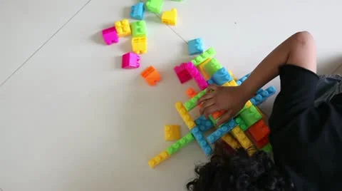 Time Lapse of Young Girl Playing with Building Blocks Stock Footage