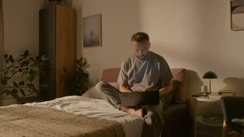 Time Lapse of Young Man Working on Laptop at Home and Sleeping at Night Stock Footage 314837202