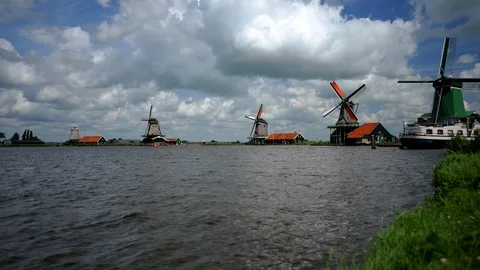 Time Lapse of Zaan River and Zaanse Schans Village Windmills Iconic Landmark Day Stock Footage 99390949