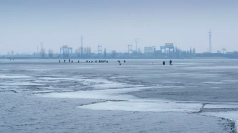 Time lapse with zoom effect of winter fishermen angling on ice Stock Footage 47346182