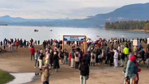 Time Lapse Zoom-in Of People Walking English Bay Beach Polar Bear Swim Vancouver Stock Footage 260220189