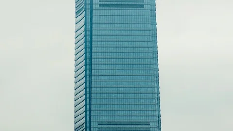 Time Lapse Zoom of Tall Skyscraper in the Clouds Hong Kong - Daytime Stock Footage 87275930