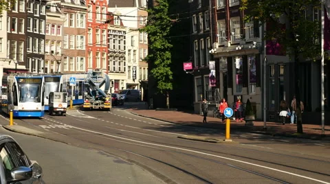 Time Lapse Zoom of Trams, Traffic &amp; People on a Busy Street in Amsterdam Stock Footage 59992194