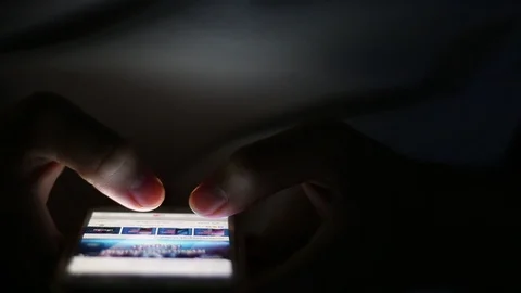 Time lapse,Close up of man hands typing scrolling pictures phone at night. Stock Footage 91074048