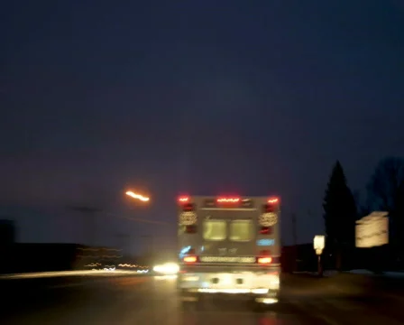 Time-lapsed drive behind an ambulance with town lights. pal Stock Footage 324432