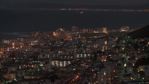 Time lapsed high angled extreme long shot of Cape Town city at night Stock Footage 310385741