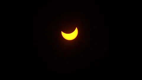 Time-lapsed shot of the partial phase of a solar eclipse moving across the Stock Footage 272406626