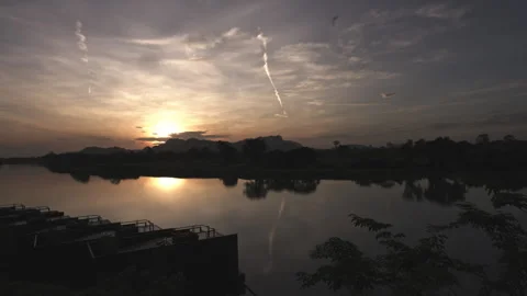 Time lapses as the sun's first rays paint a breathtaking canvas over the Stock Footage 248579106