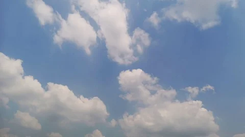 Time lapse,sky beautiful cloud scape white fluffy clouds over blue sky. Stock Footage 96073676