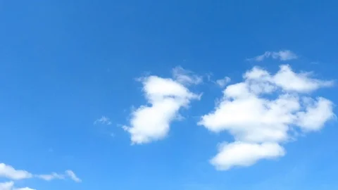 Time lapse,sky beautiful cloud scape white fluffy clouds over blue sky. Stock Footage 98750793
