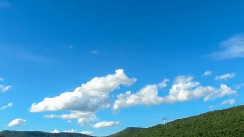 Time lapse,sky beautiful cloud scape white fluffy clouds over blue sky. Stock Footage 122586145
