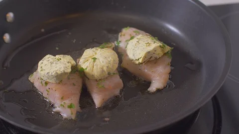Time Laspse. Raw fish fillets fried in a pan with butter Stock-Footage 111969297