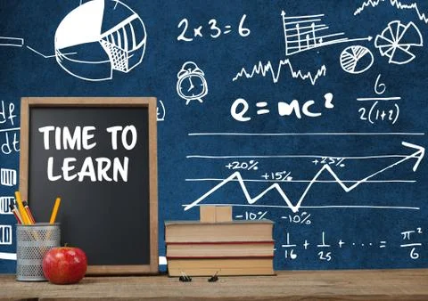Time to learn Desk foreground with blackboard graphics of math science equations Foto stock