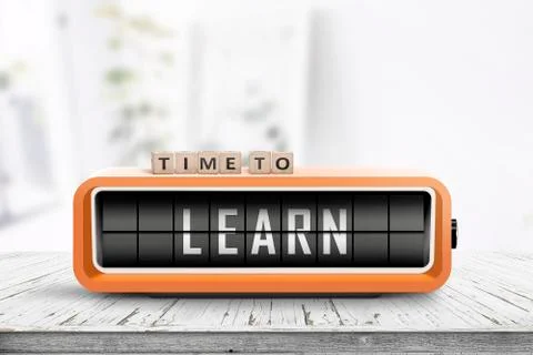 Time to learn message on a retro alarm clock Stock Photos